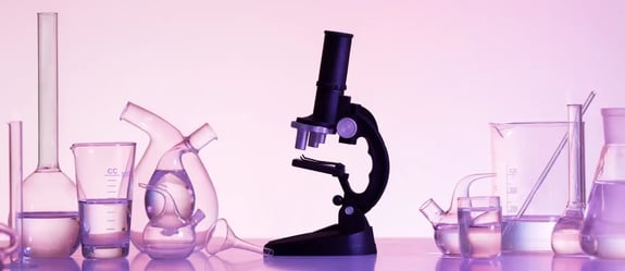 Laboratory glassware and microscope